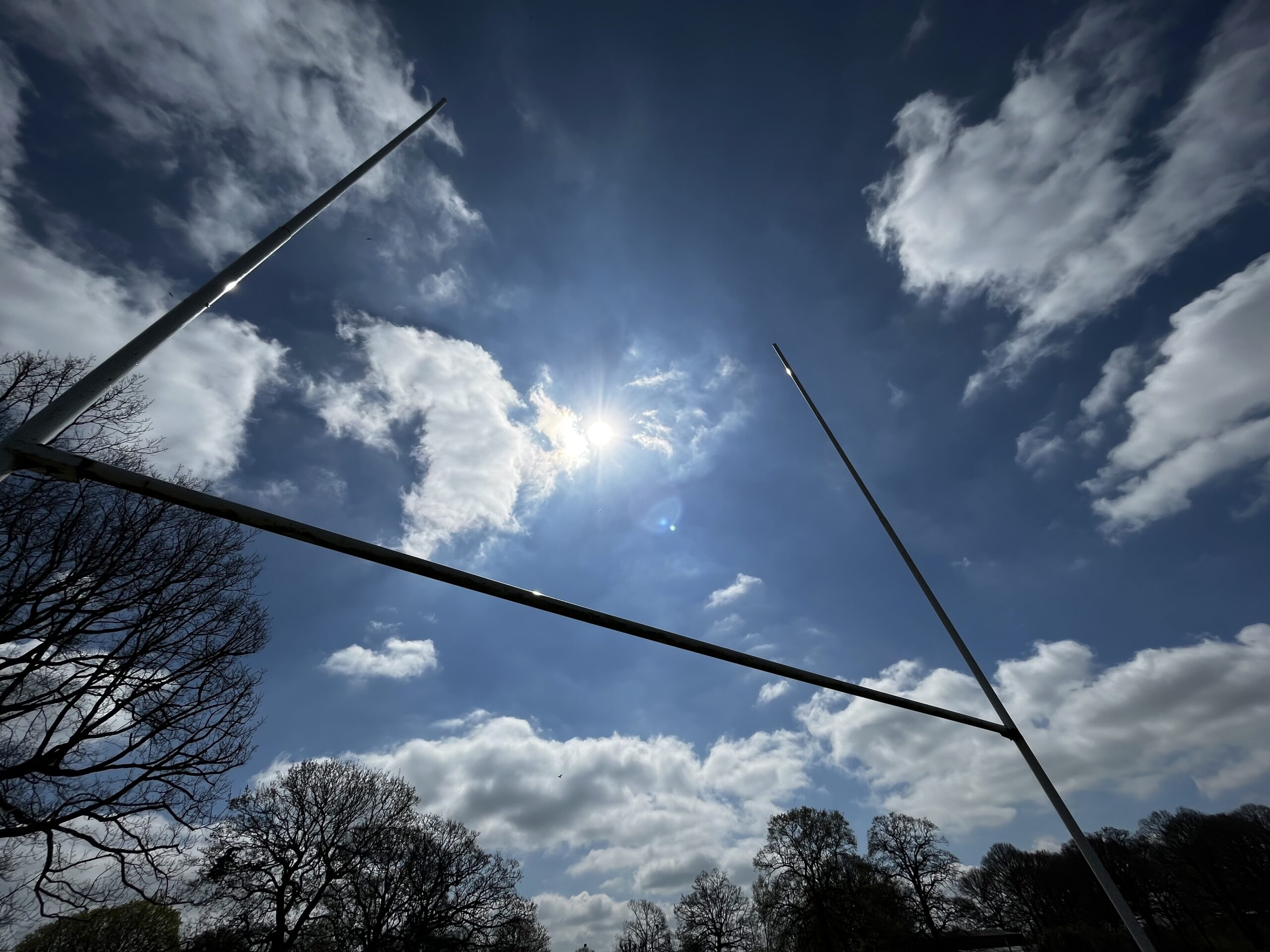 Rugby posts against a bright sky